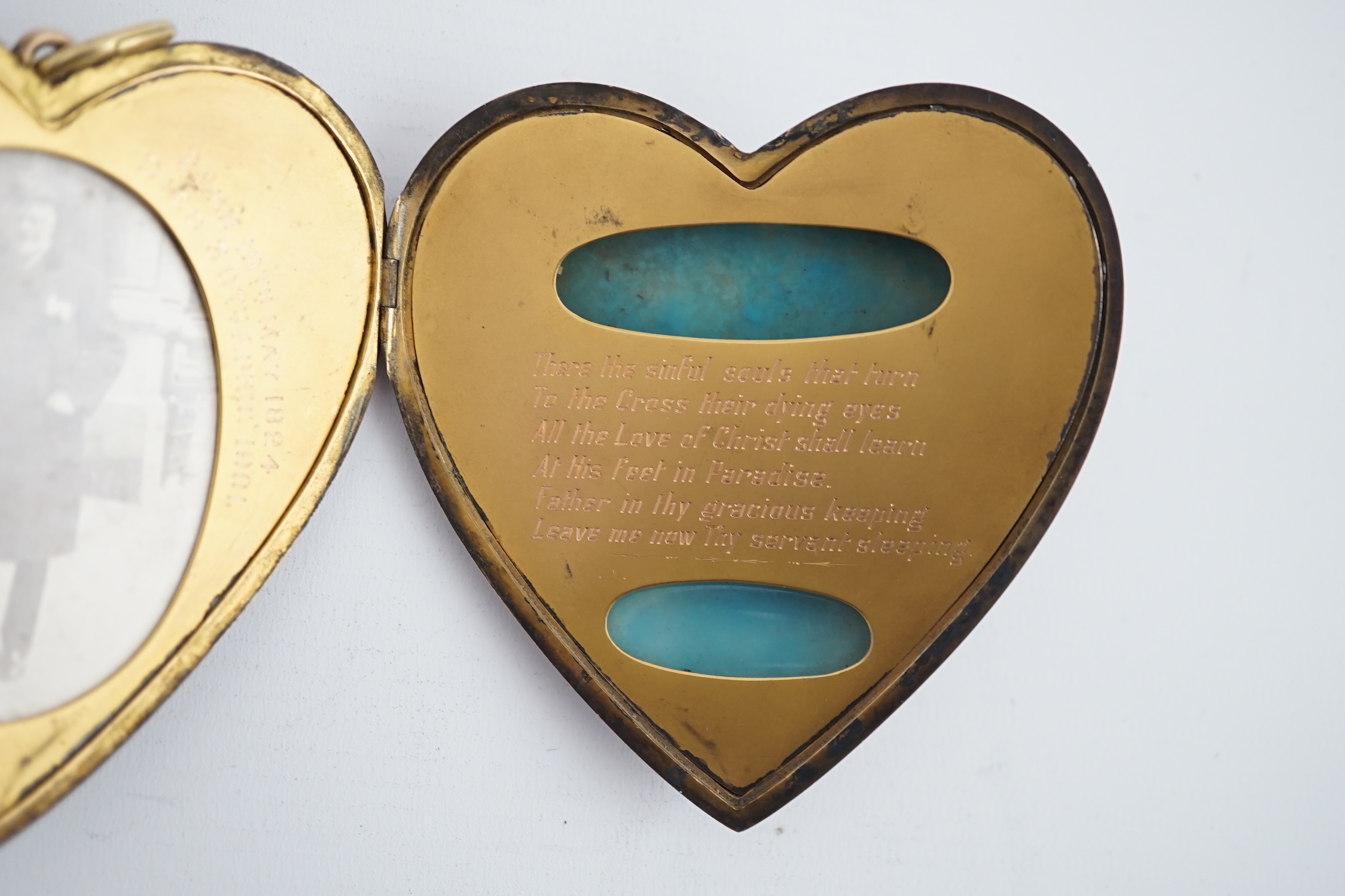 An Edwardian silver gilt? and guilloche enamel large heart shaped memorial locket